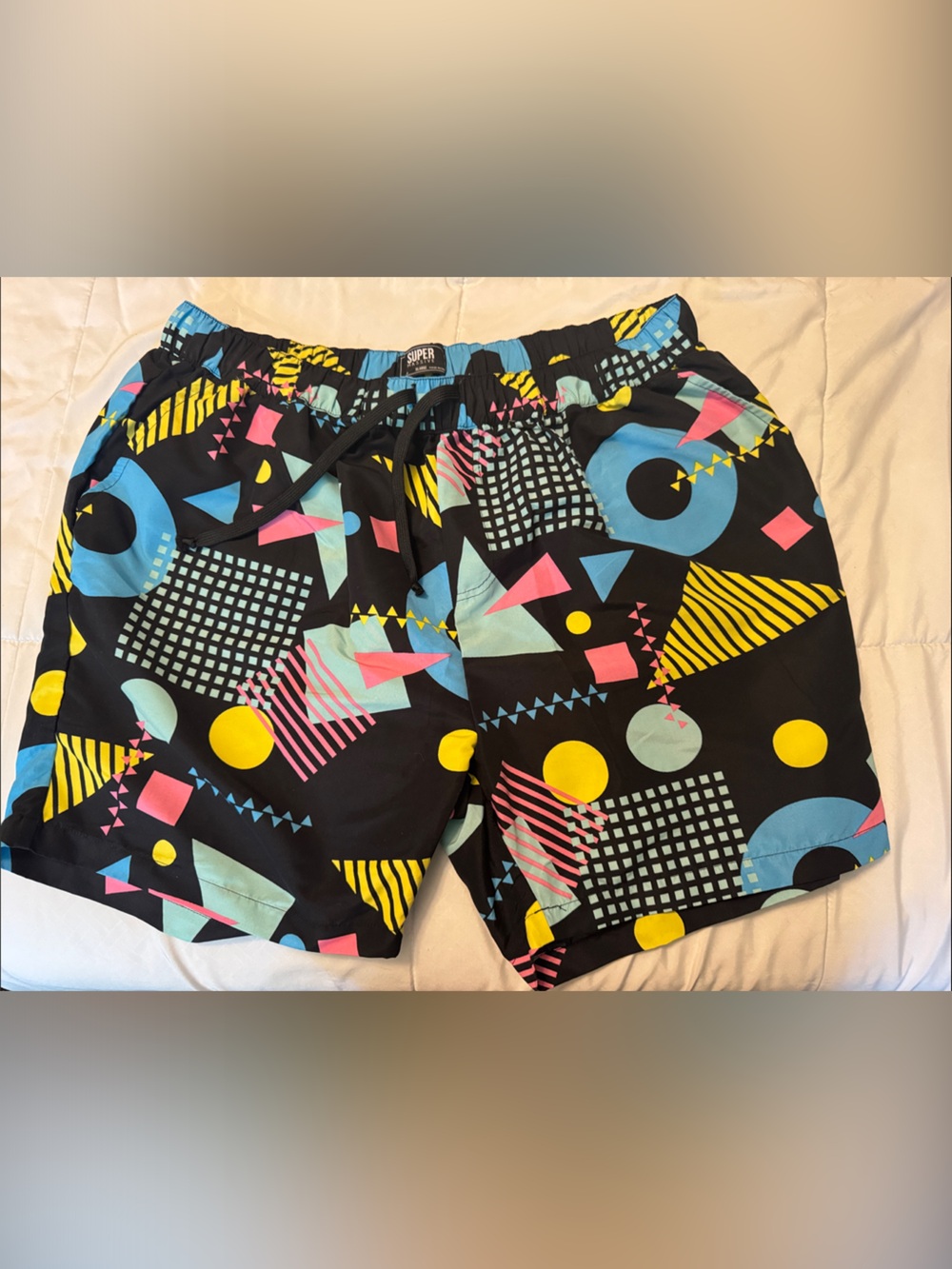 Men's Black Geometric Print Swim Trunks with Blue, Yellow & Pink Accents
